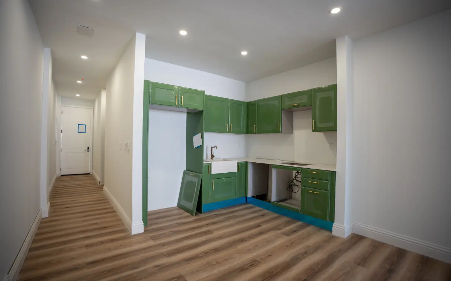 Green kitchen cabinets at Casa Playa Unit 315