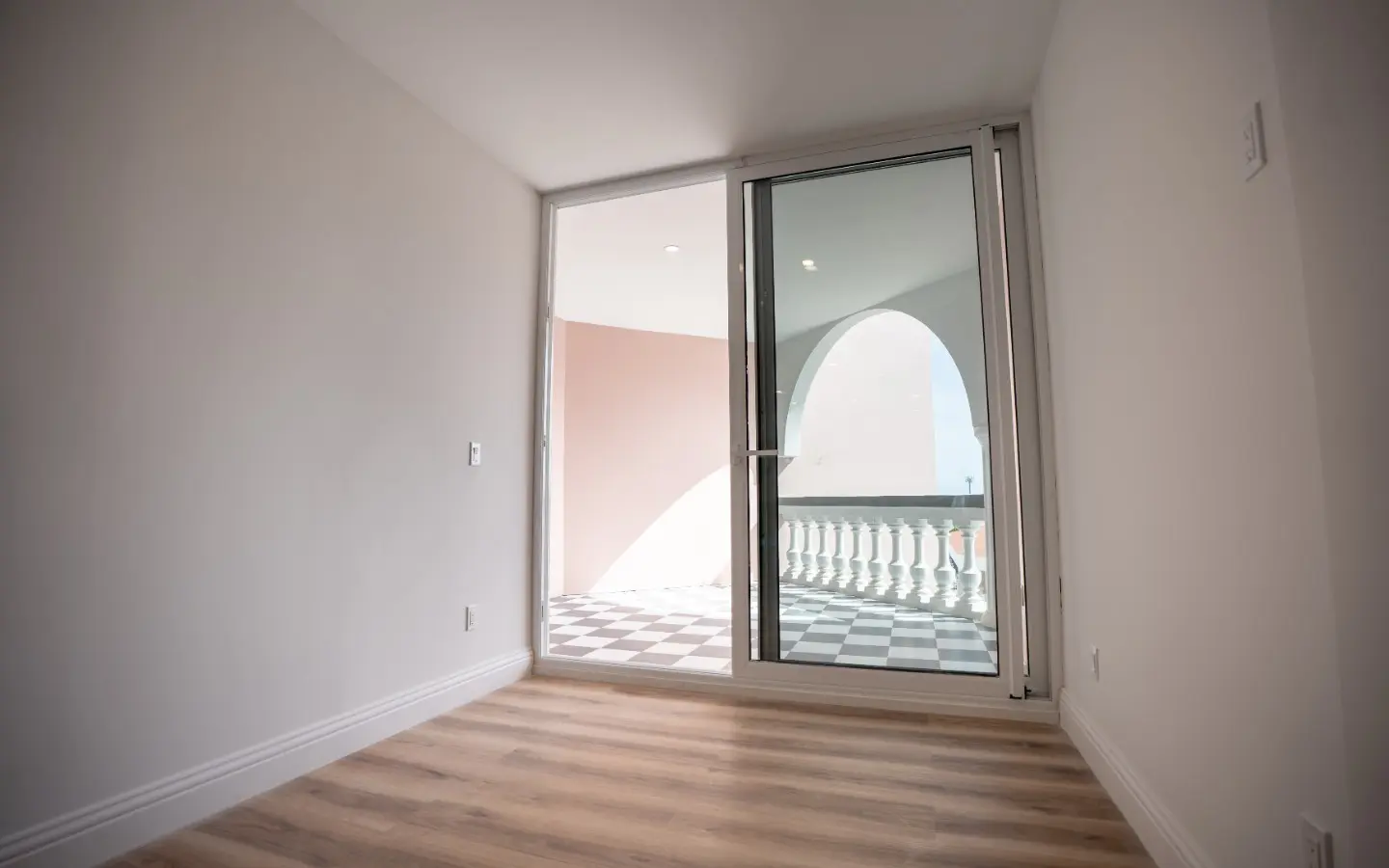 Open living and dining area at Casa Playa 315 with sliding doors to the private balcony, Oranjestad
