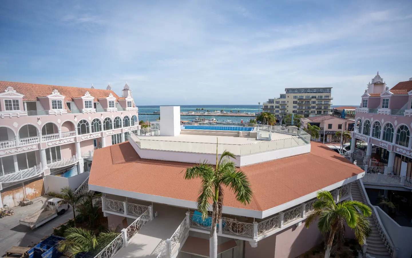 View from inside the condo through the terrace door to the arched balcony and balustrade