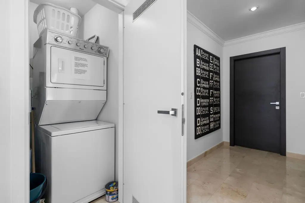 Indoor laundry room area in the hallway to the bedrooms