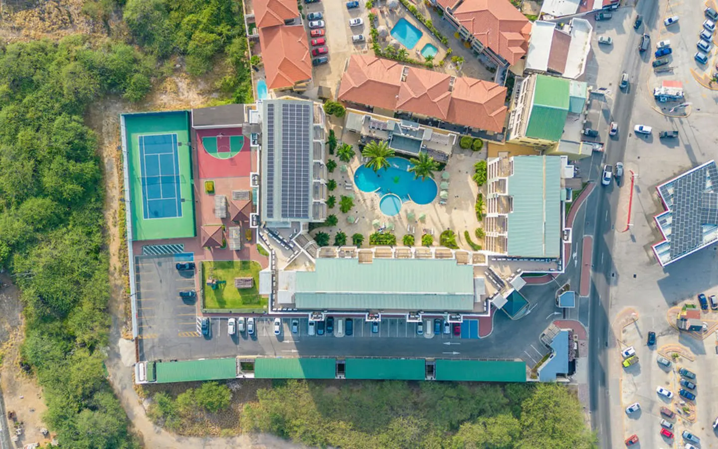 Aerial of the PalmAruba condominium and its pool courtyard in Palm Beach, Aruba