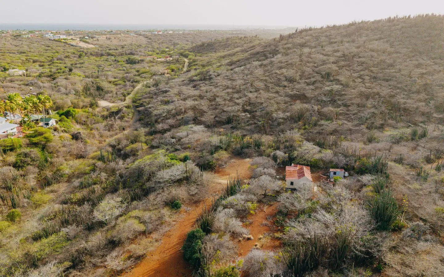 Aerial of Rooi Taki 9 with the Caribbean Sea on the horizon