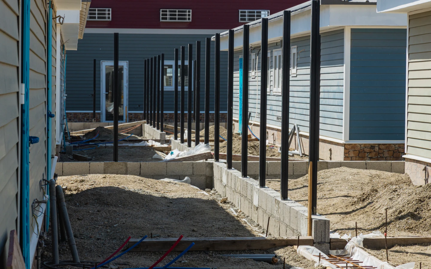 Porch columns and block work between two villas at Caribbean Town during construction