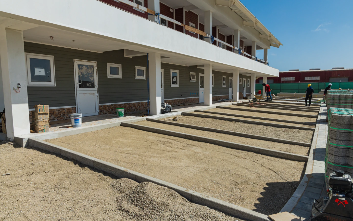 Walkways and terraces taking shape outside a row of villas at Caribbean Town