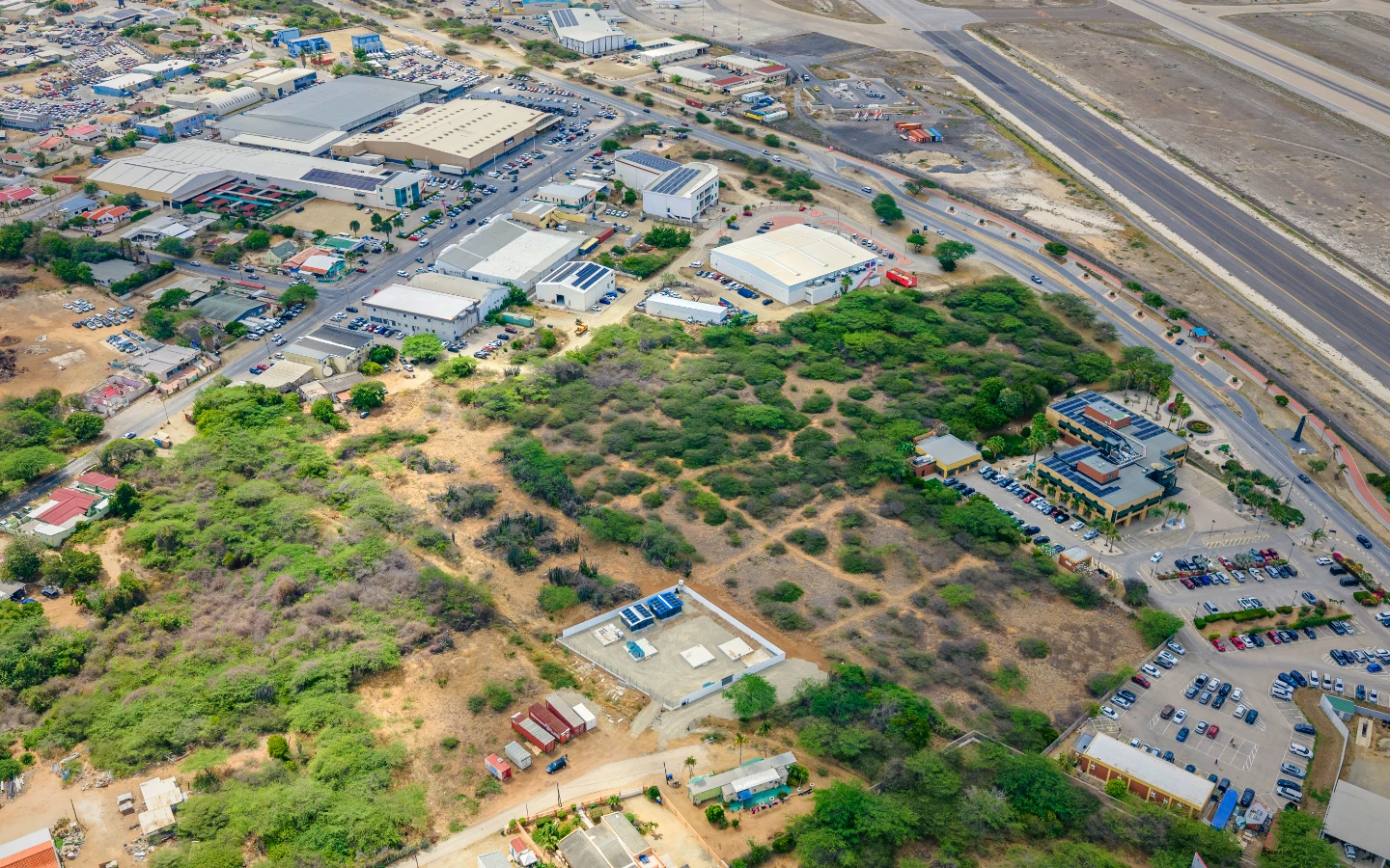 The parcel surrounded by established commercial tenants along the Oranjestad to San Nicolas road