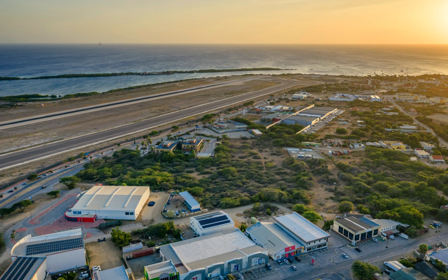 Evening aerial of the parcel with the runway, marina and Caribbean coastline in the background
